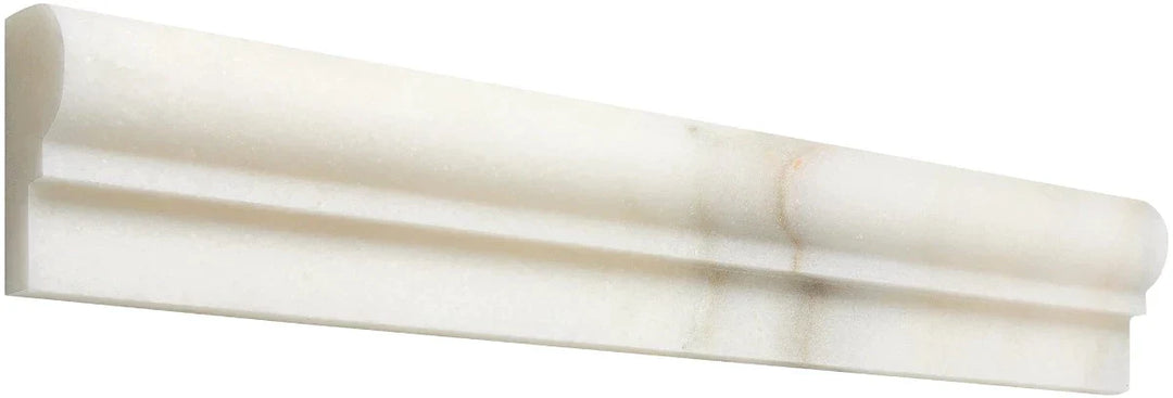 Calacatta Oliva marble pencil liner and baseboard trims in white with veining