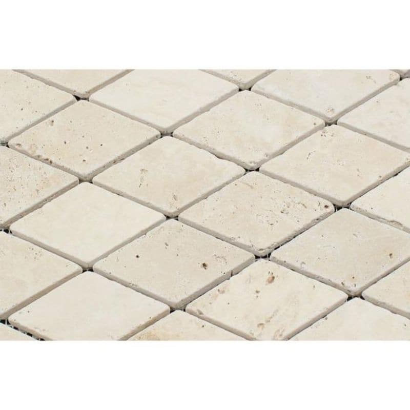 Diamond mosaic tile in travertine deep-beveled lozenge pattern