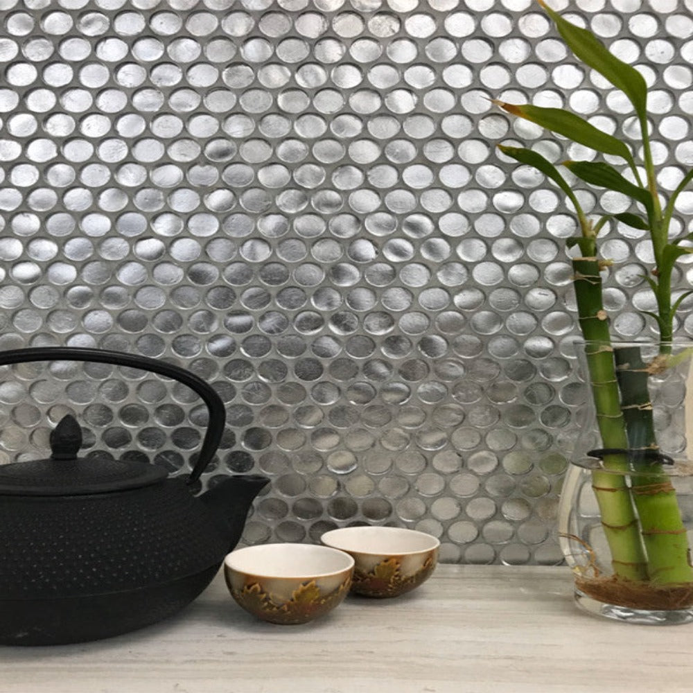 Gray mosaic tile in marble hexagon and herringbone patterns