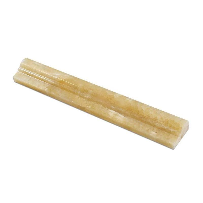 Honey Onyx polished pencil liner and chair rail trims in golden tones
