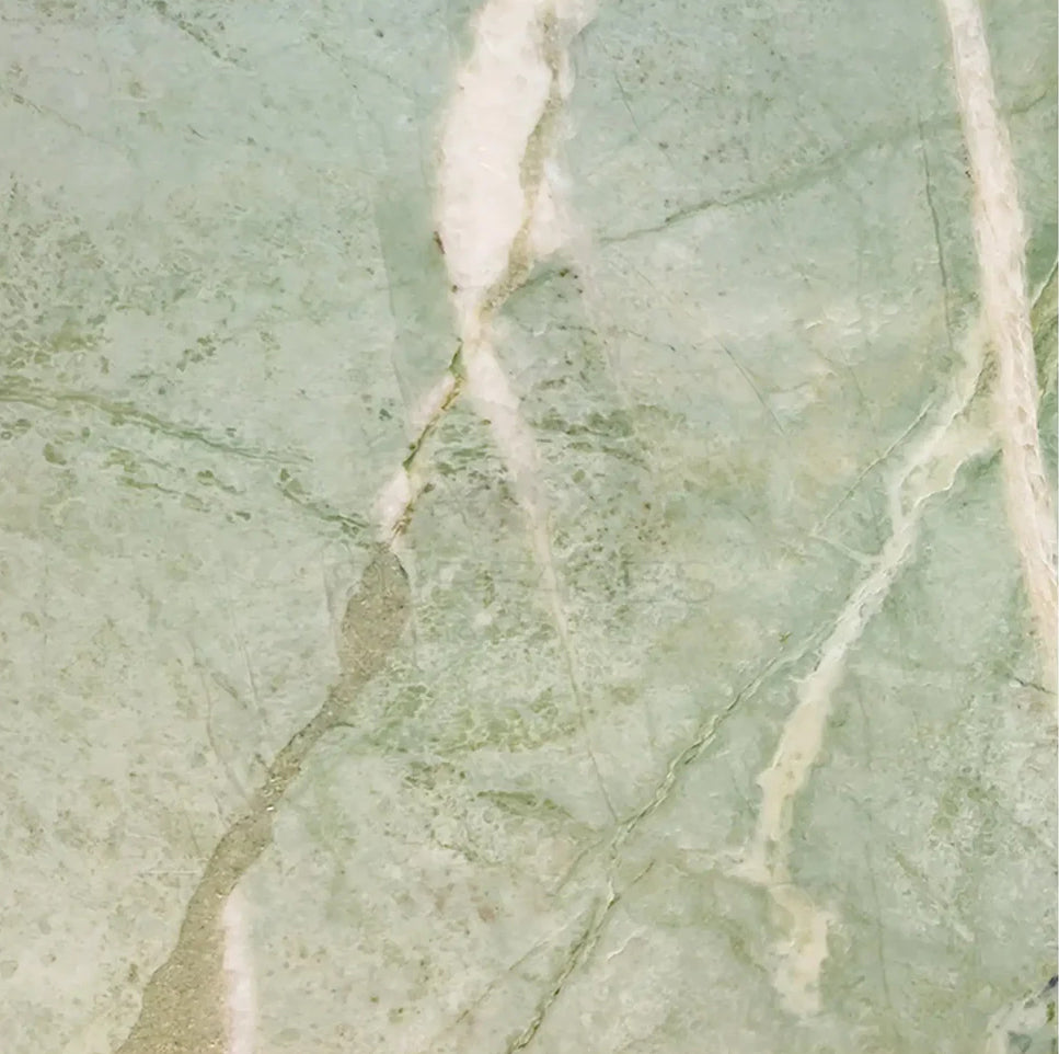 Green tile in Ming Green marble, limestone, and glass tones