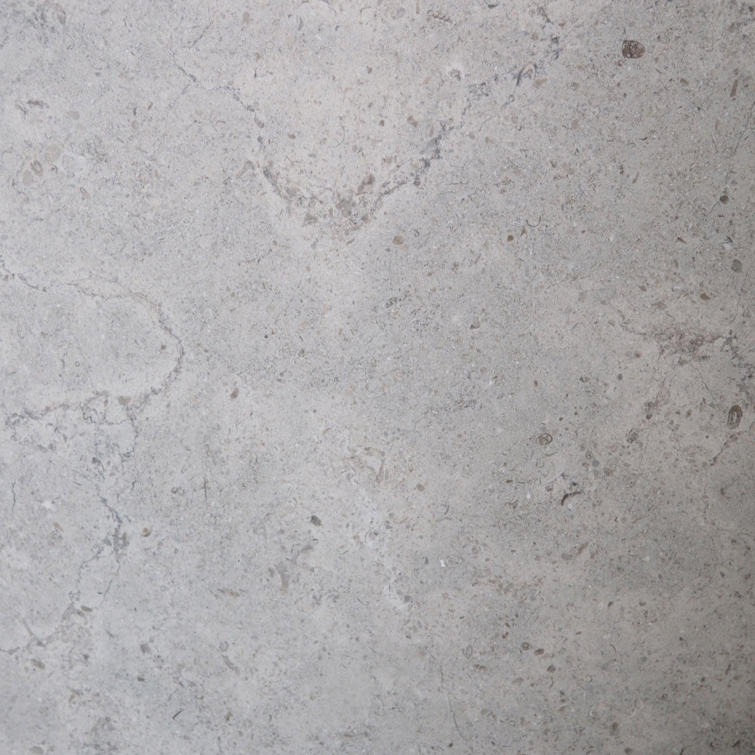 Gascogne Blue Limestone 12x12 honed natural stone tile, showcasing smooth blue-gray surface and subtle texture.