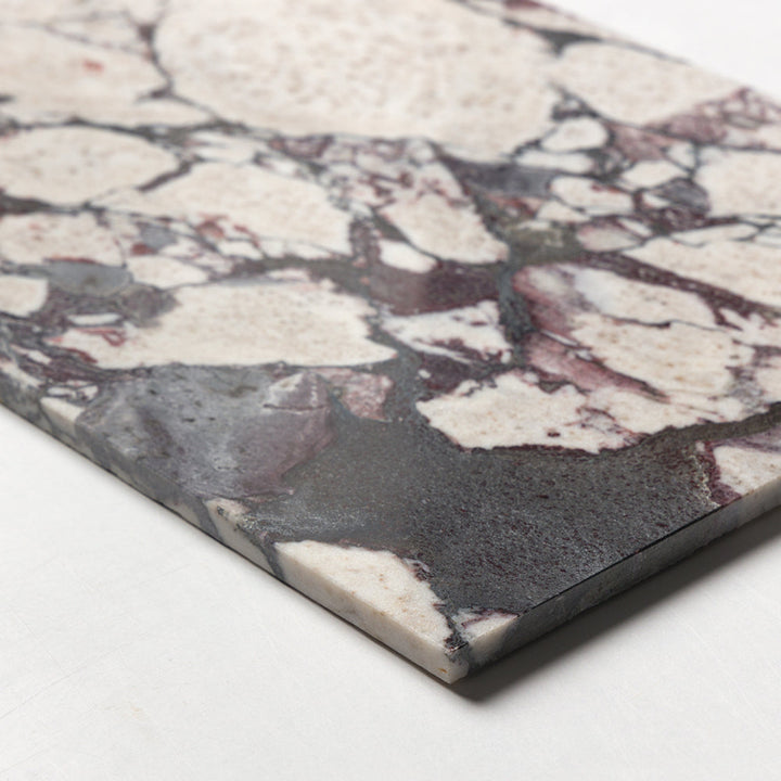 Calacatta Viola marble 12x12 honed tile showing white and purple veined natural stone surface with polished finish.