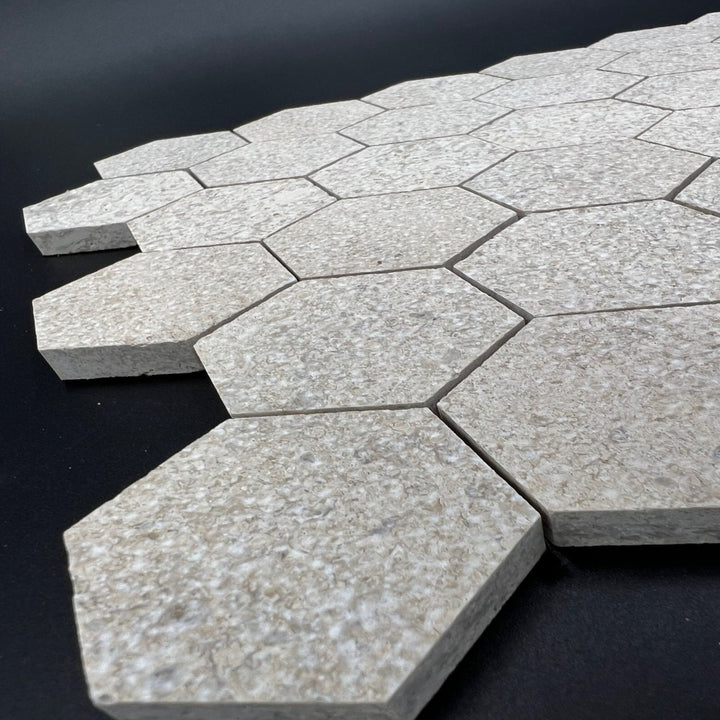 Mocha cream limestone antique Chanteau 2x2 hexagon mosaic tile by TILE AND MOSAIC DEPOT, showcasing textured, earthy stone pattern.