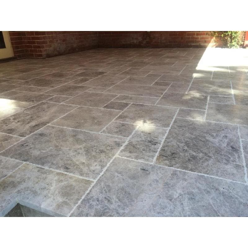 Silver travertine natural stone tile with brushed and chiseled Versailles pattern, showcasing textured surface and elegant design.