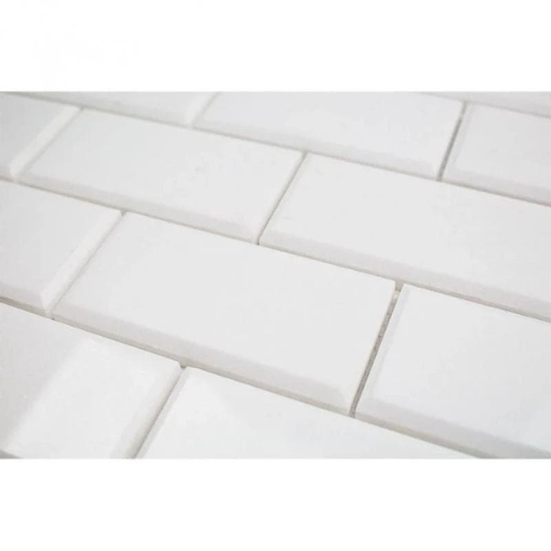 Thassos White Marble deep-beveled 2x4 honed mosaic tile, showcasing smooth, elegant white marble with beveled edges for a refined look.