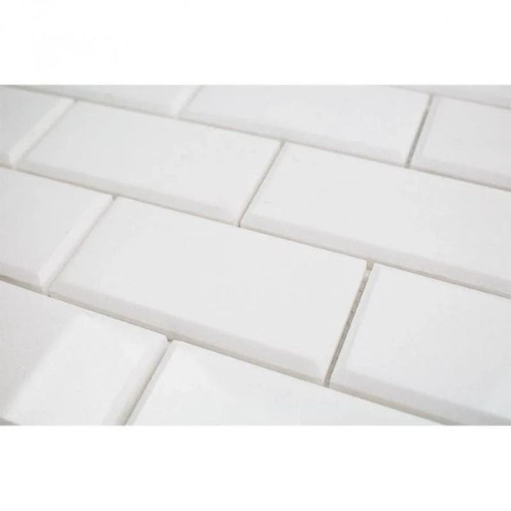 Thassos White Marble deep-beveled 2x4 honed mosaic tile, showcasing smooth, elegant white marble with beveled edges for a refined look.