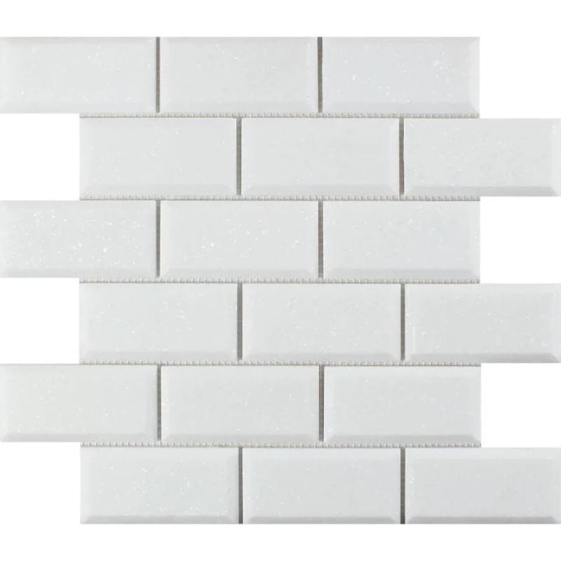 Thassos White Marble deep-beveled 2x4 honed mosaic tile showing polished surface and intricate tile pattern.
