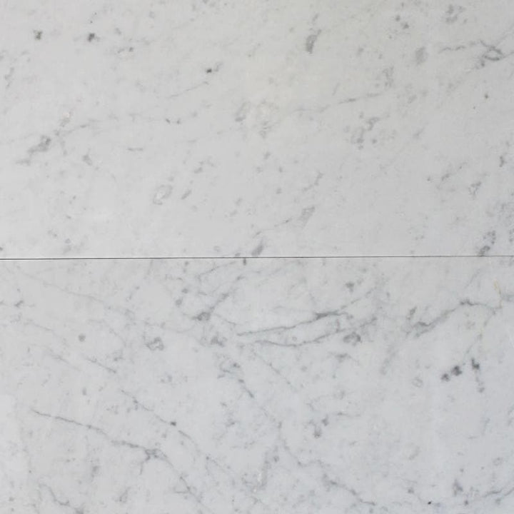 White Carrara marble 12x24 polished natural stone tile with gray veining, ideal for elegant flooring or backsplash design.