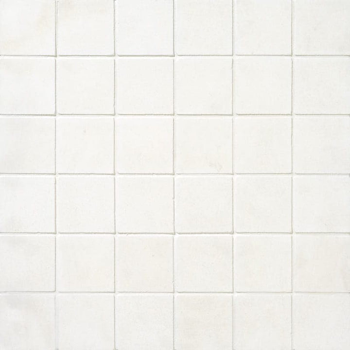 White Pearl Limestone 2x2 honed marble mosaic tile showcasing smooth, natural stone with a subtle, elegant pattern.